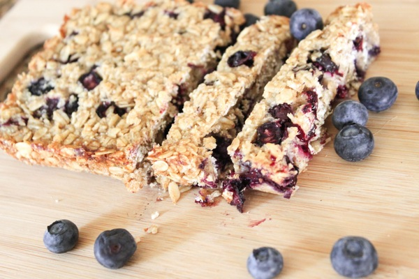 Blueberry Oat Bars plated on a Moon and Moo baby plate